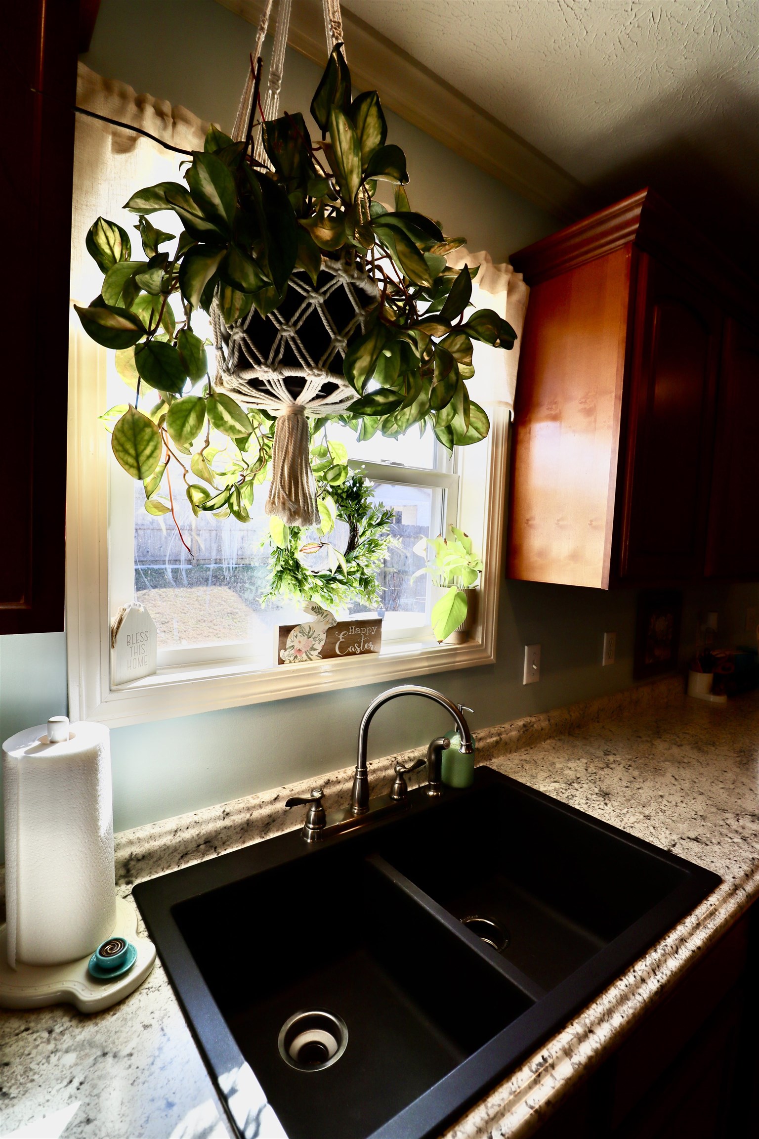 228 Edgewood Drive Adamsville, TN 38310 - Photo 30 of 37 Details featuring a textured ceiling, light stone counters, dark brown cabinets, and a sink