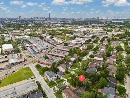 an aerial view of residential building with an outdoor space and seating area