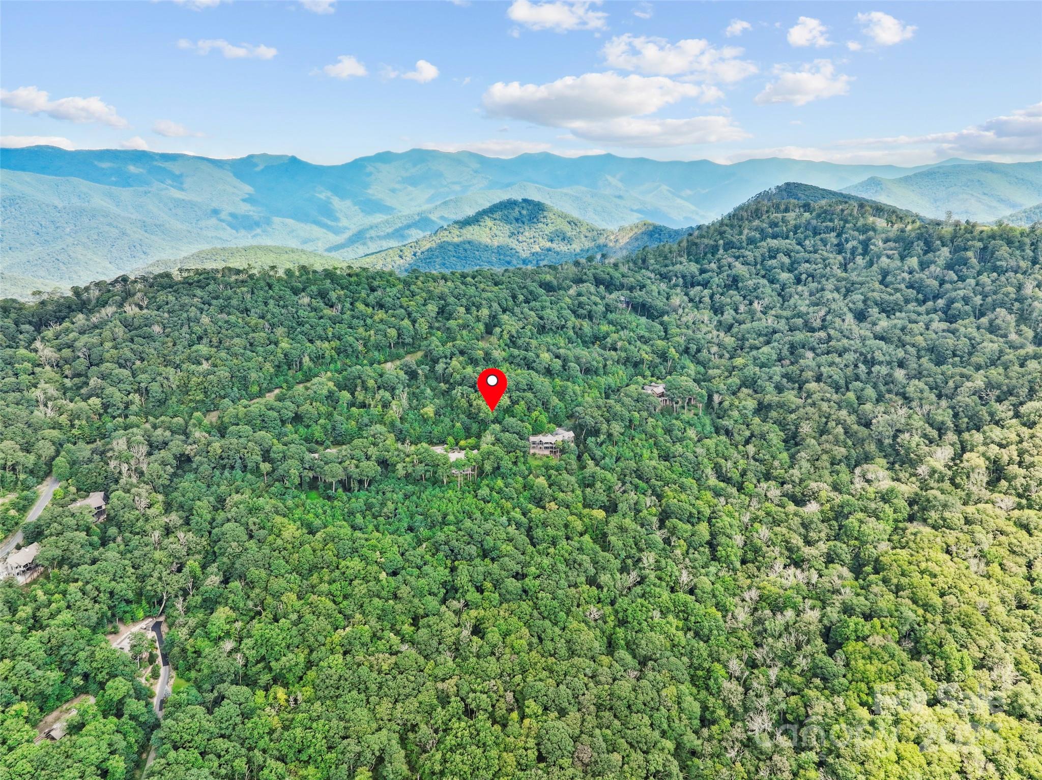 Lot 9 Wormy Chestnut Road Apex, NC 27523 - Photo 16 of 16 a view of a lush green field with a mountain in the background