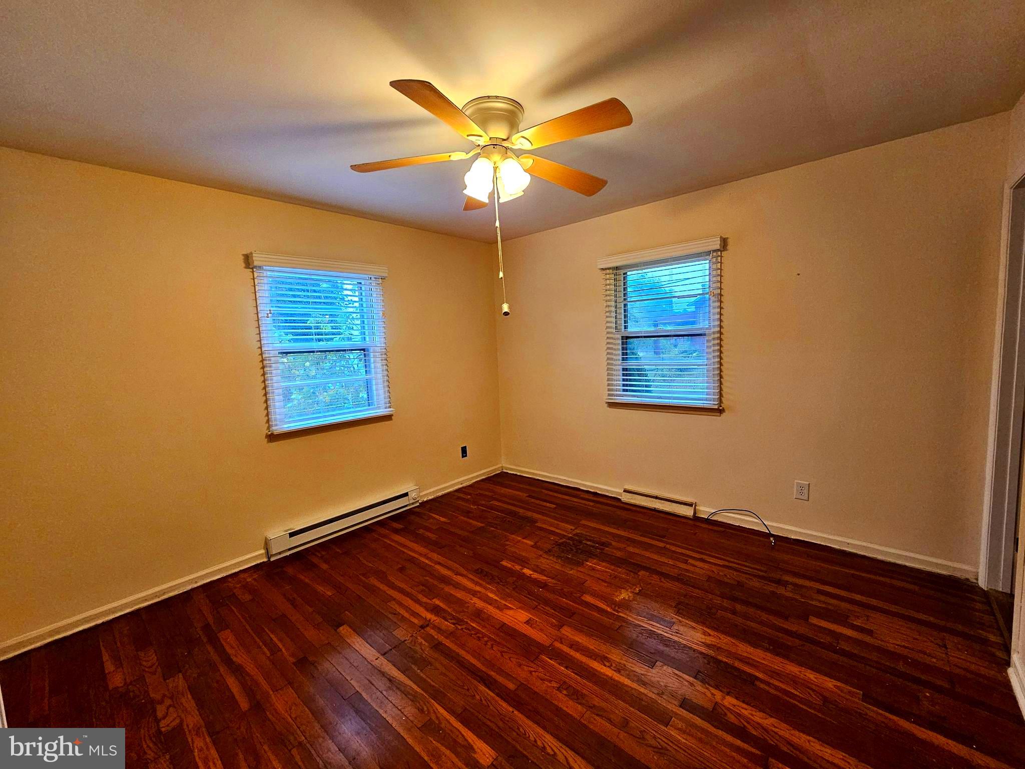 310 Bethel Road Paw Paw, WV 25434 - Photo 13 of 30 a view of an empty room with window and wooden floor