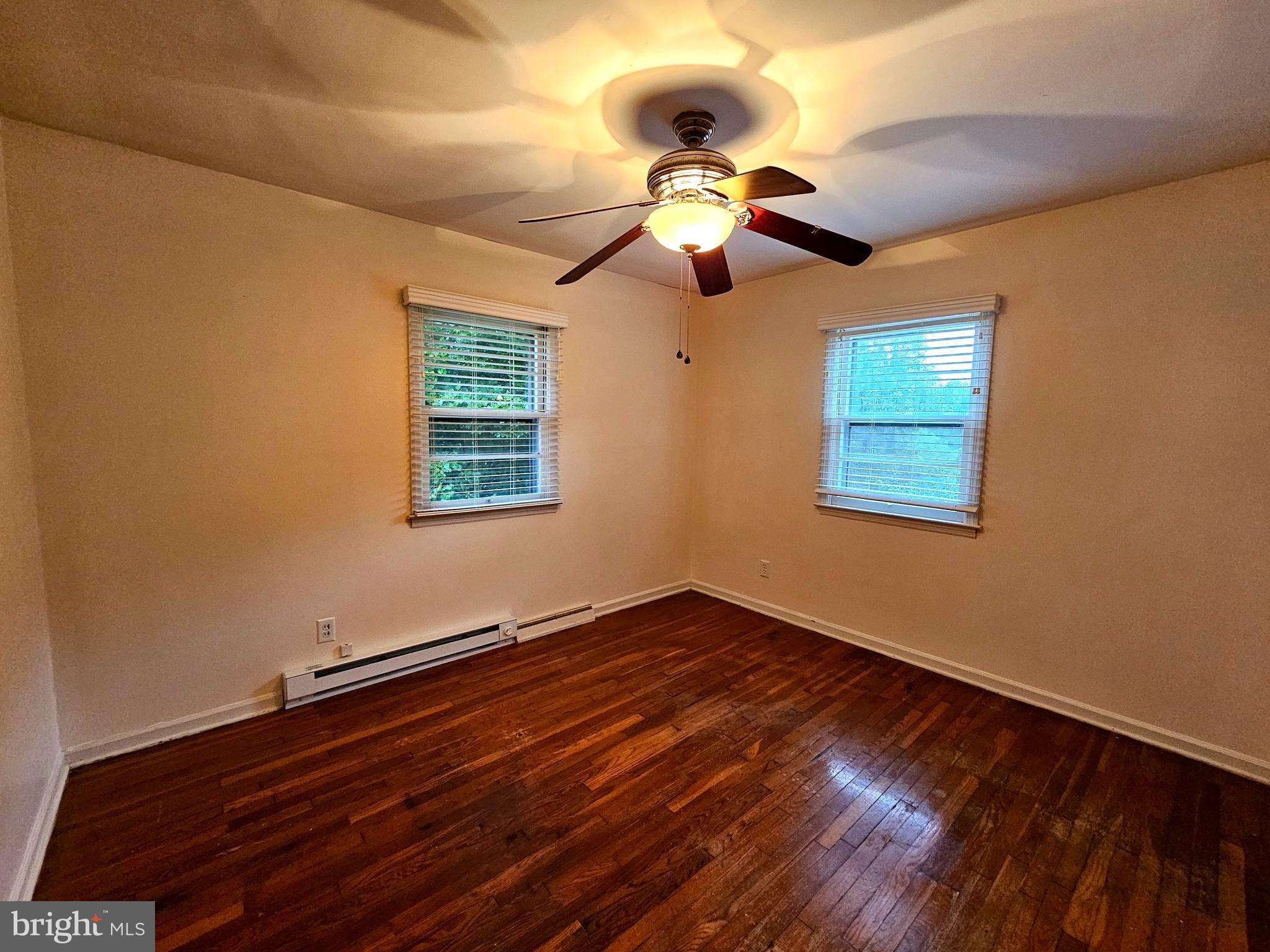 310 Bethel Road Paw Paw, WV 25434 - Photo 17 of 30 a view of an empty room with wooden floor and a window