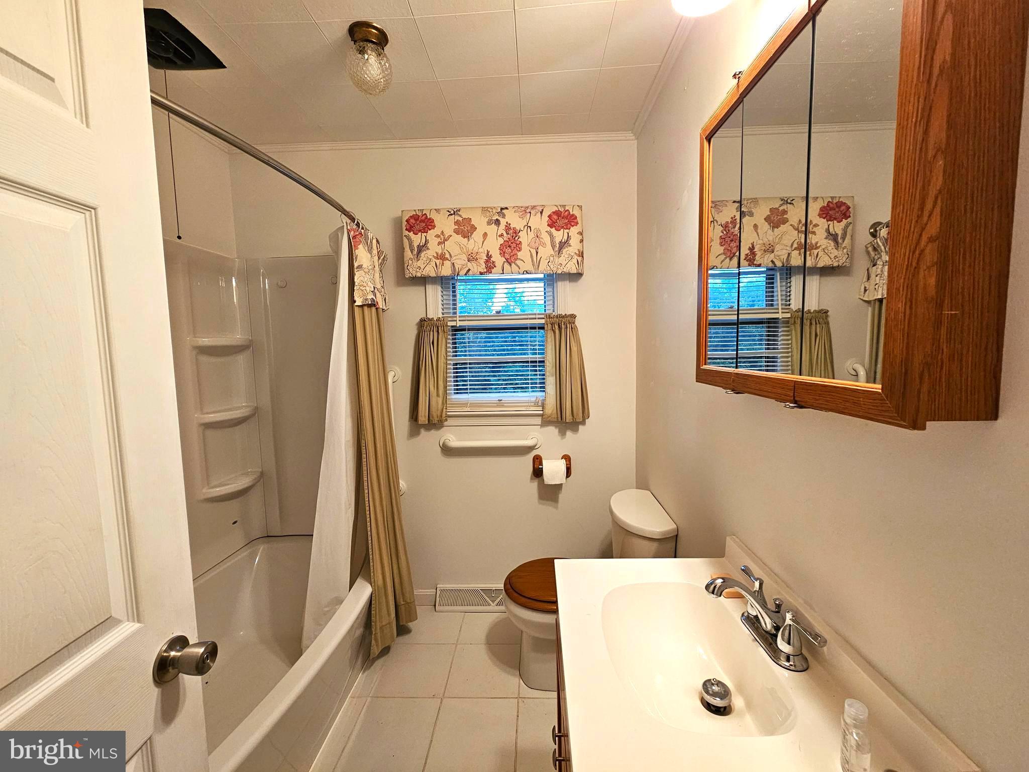 310 Bethel Road Paw Paw, WV 25434 - Photo 19 of 30 a bathroom with a tub a sink and glass door