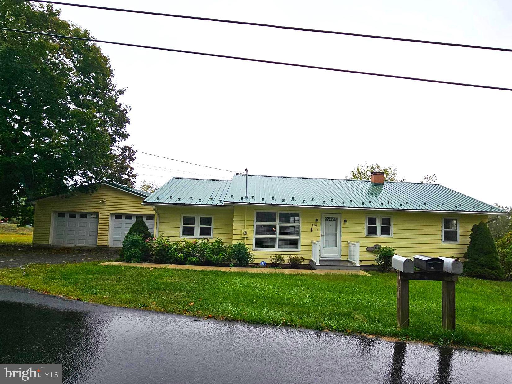 310 Bethel Road Paw Paw, WV 25434 - Photo 2 of 30 a view of a house with a yard
