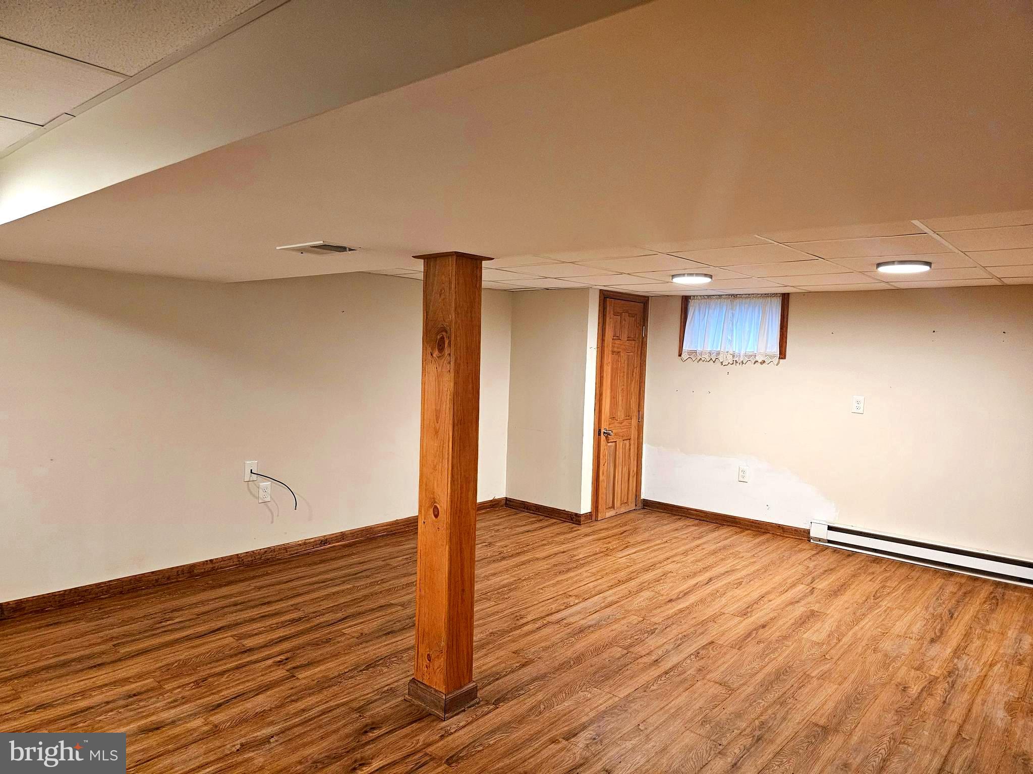 310 Bethel Road Paw Paw, WV 25434 - Photo 21 of 30 a view of an empty room with wooden floor