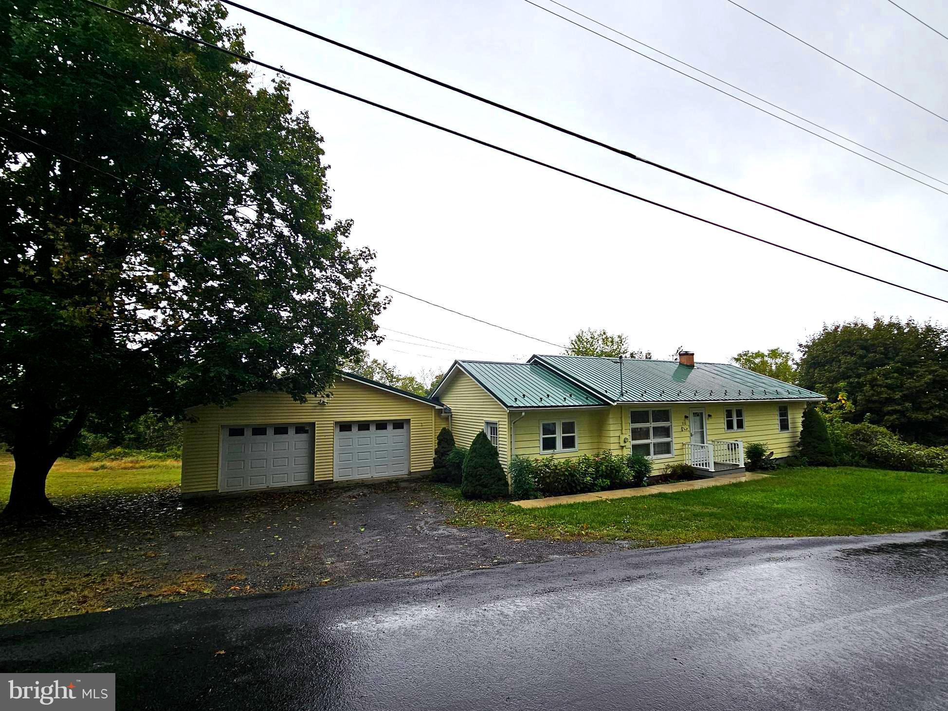 310 Bethel Road Paw Paw, WV 25434 - Photo 27 of 30 a front view of a house with a yard