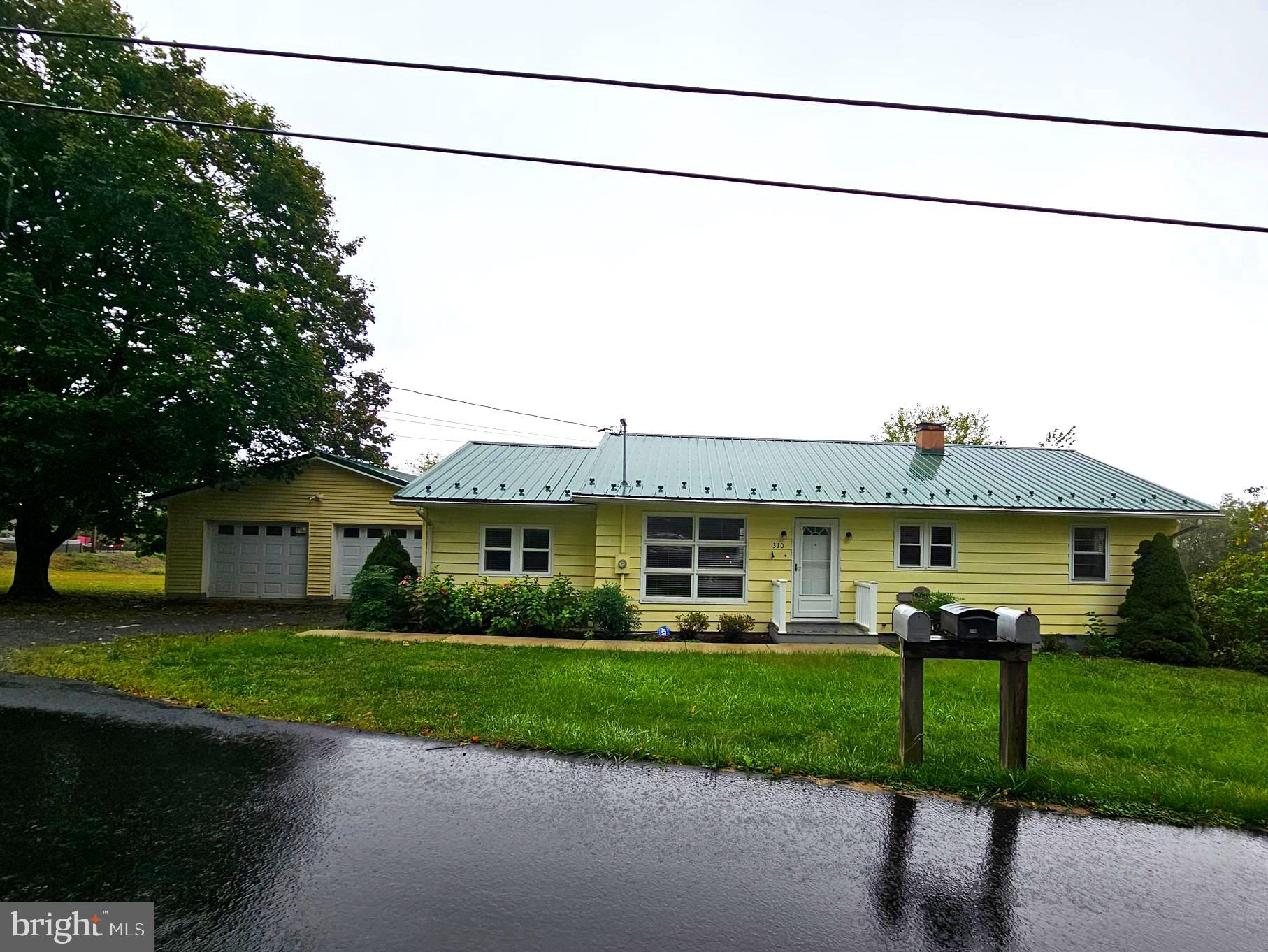 310 Bethel Road Paw Paw, WV 25434 - Photo 29 of 30 a view of a house with a patio