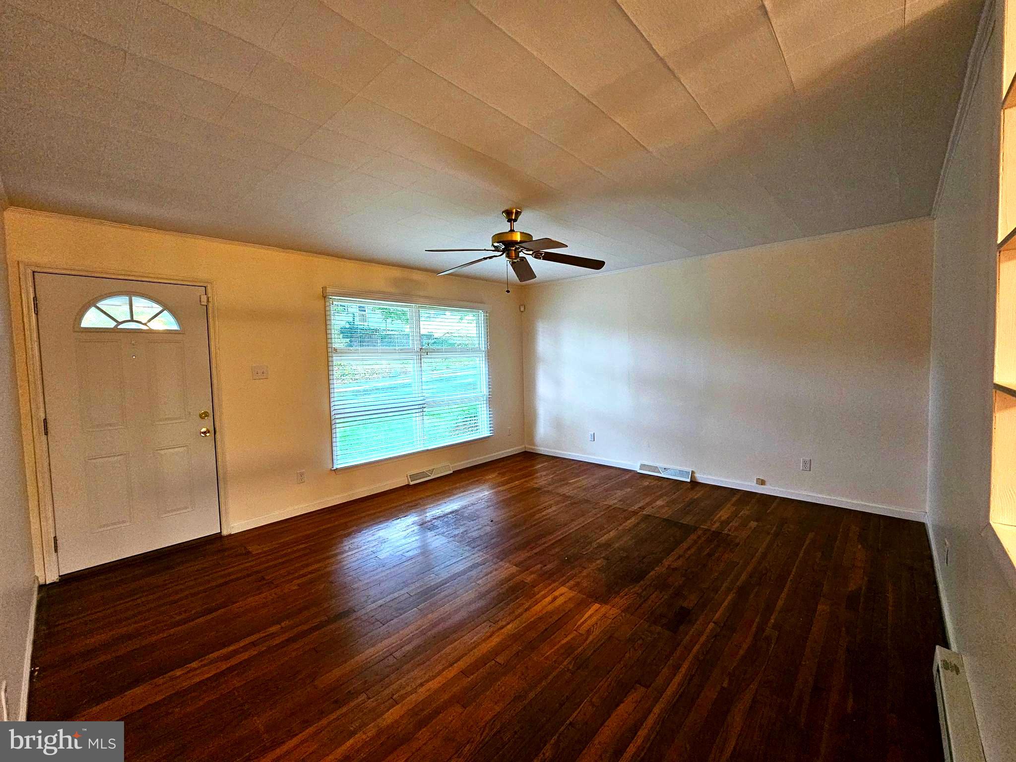 310 Bethel Road Paw Paw, WV 25434 - Photo 7 of 30 wooden floor in an empty room with a window