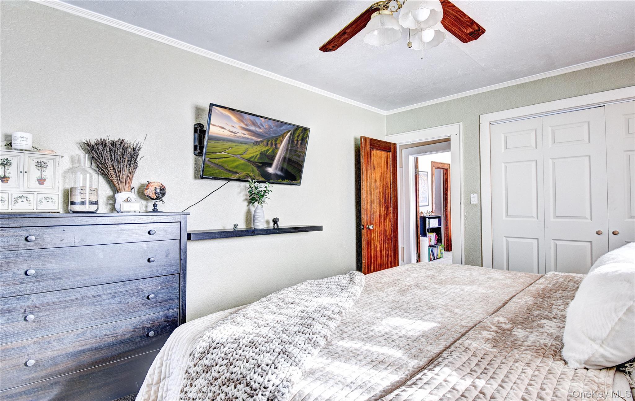 99 South Main Street Florida, NY 10921 - Photo 17 of 35 a bedroom with a bed and a flat screen tv