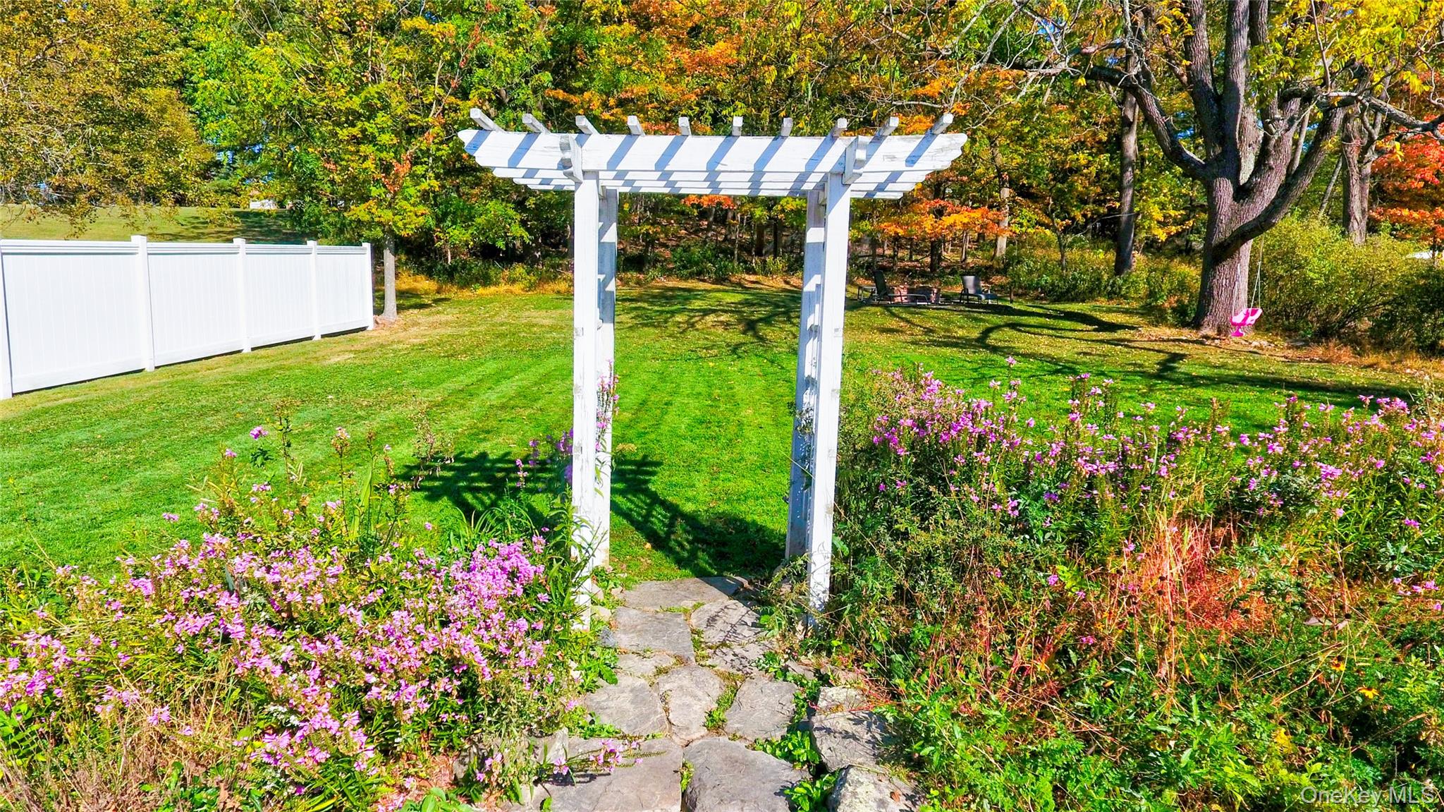 99 South Main Street Florida, NY 10921 - Photo 22 of 35 a backyard of a house with lots of green space and plants