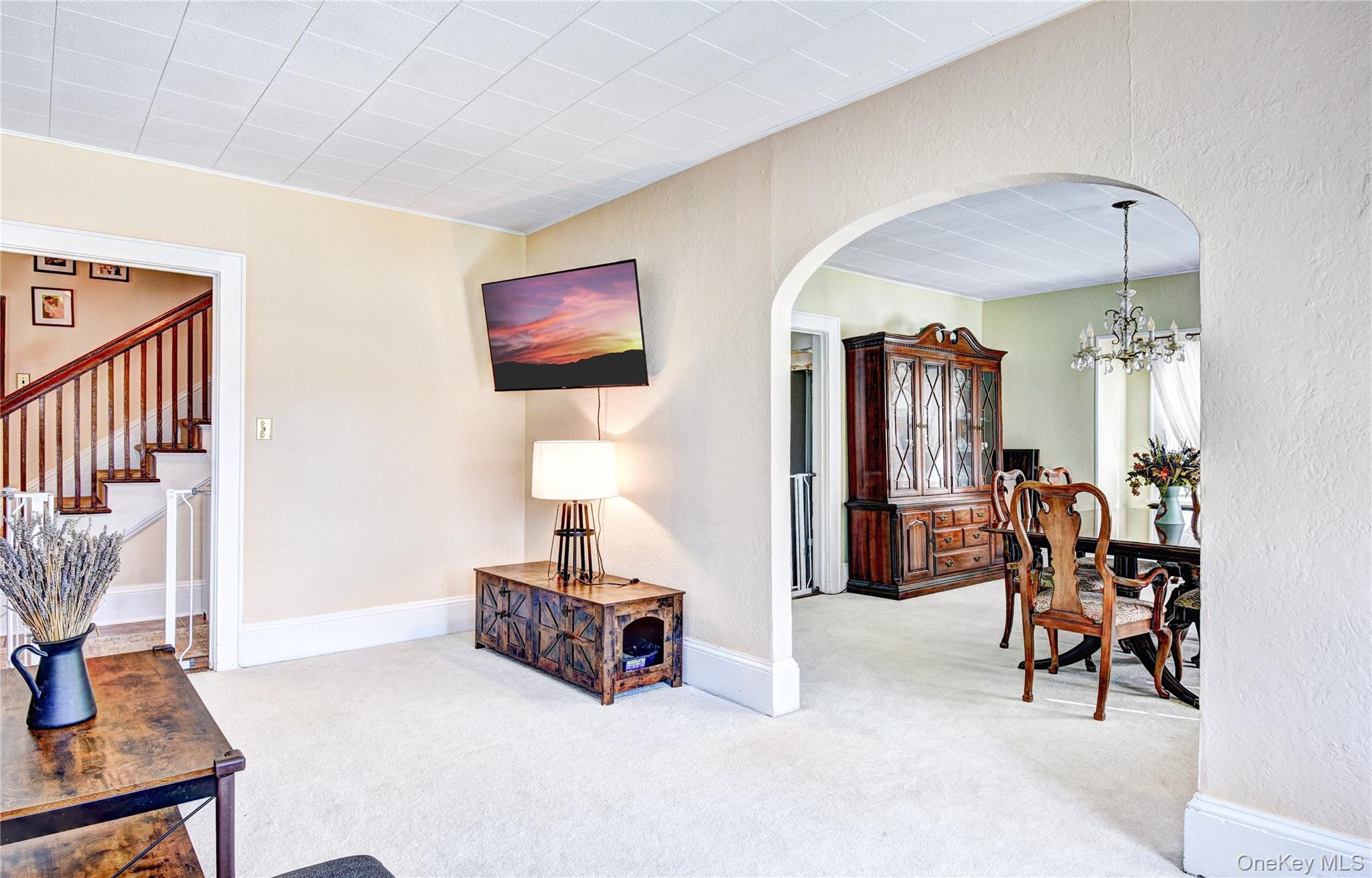99 South Main Street Florida, NY 10921 - Photo 4 of 35 a living room with furniture and a dining table with chairs