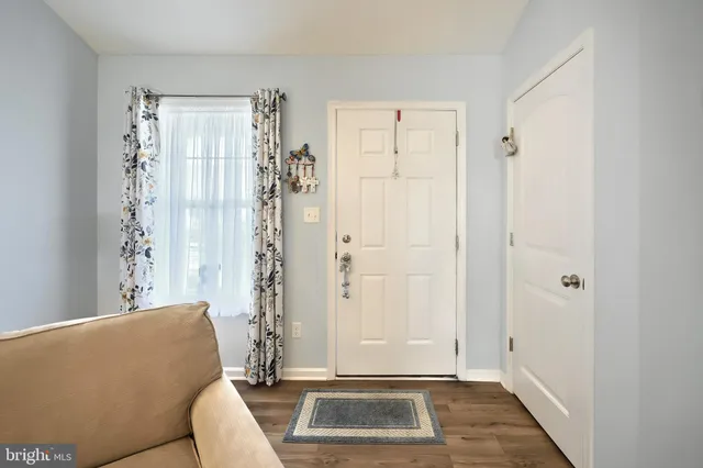a living room with a couch and a window