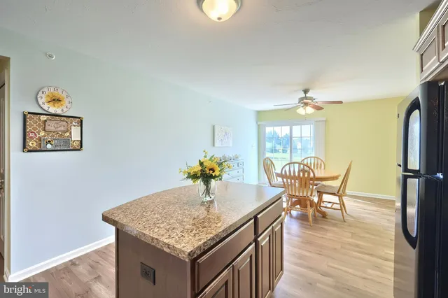 a kitchen with a table and chairs