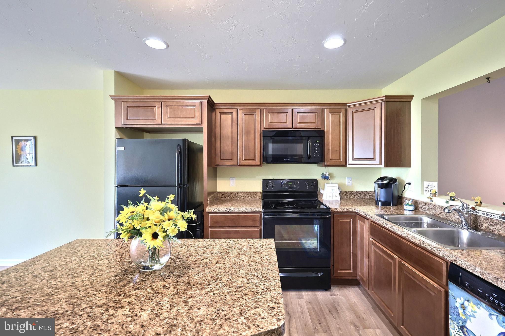 3690 Rye Court, Unit 2 Dover, PA 17315 - Photo 21 of 32 a kitchen with stainless steel appliances granite countertop a sink stove and refrigerator