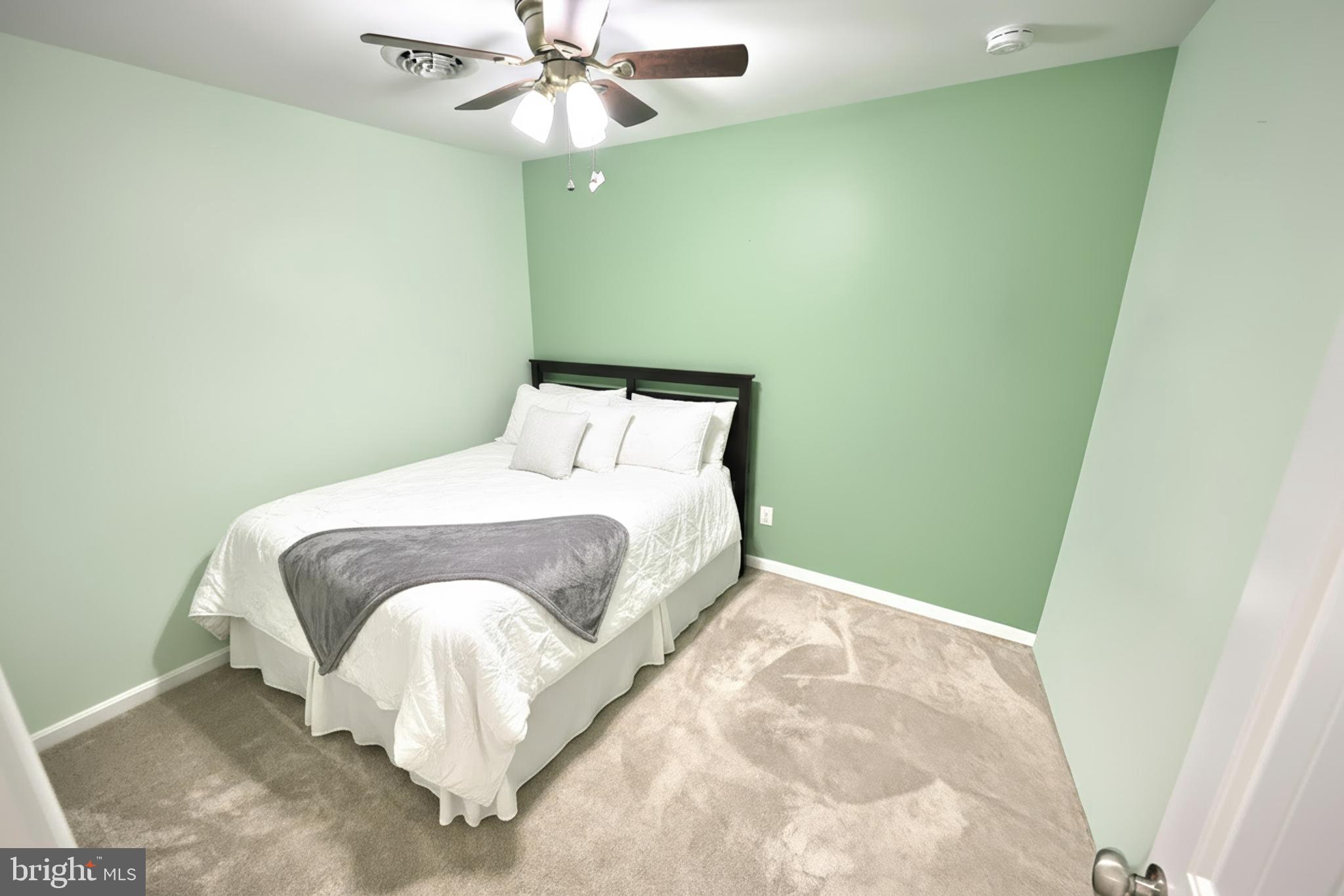 3690 Rye Court, Unit 2 Dover, PA 17315 - Photo 23 of 32 a bedroom with a bed and a fan