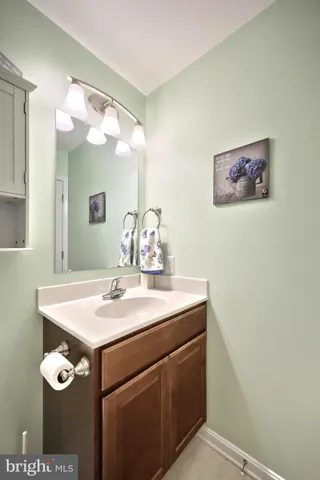 a room with a sink and a mirror