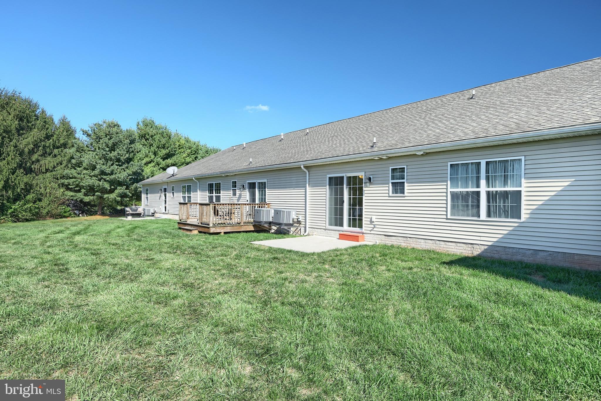 3690 Rye Court, Unit 2 Dover, PA 17315 - Photo 9 of 32 a front view of a house with yard patio and green space