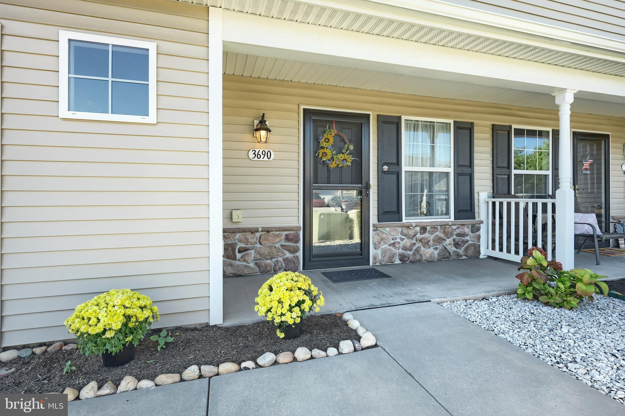 3690 Rye Court, Unit 2 Dover, PA 17315 - Photo 10 of 32 a view of a chair and a back door of the house
