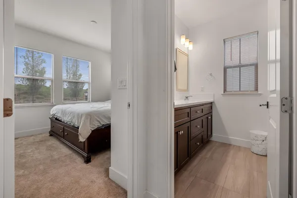 a bedroom with a bed and a view of bathroom