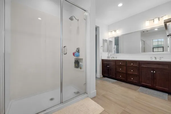 a bathroom with a granite countertop sink mirror and double