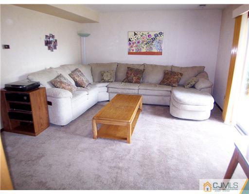 66 East Cliff Road Colonia, NJ 07067 - Photo 13 of 18 a living room with furniture and a couch