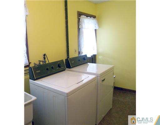 66 East Cliff Road Colonia, NJ 07067 - Photo 15 of 18 a utility room with dryer and washer