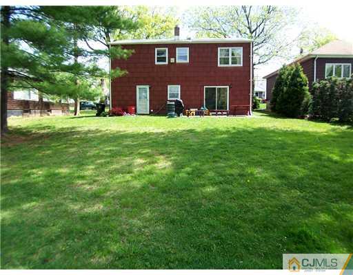 66 East Cliff Road Colonia, NJ 07067 - Photo 16 of 18 a view of building with yard