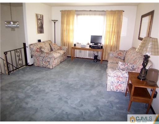 66 East Cliff Road Colonia, NJ 07067 - Photo 3 of 18 a spacious bedroom with a bed and large windows