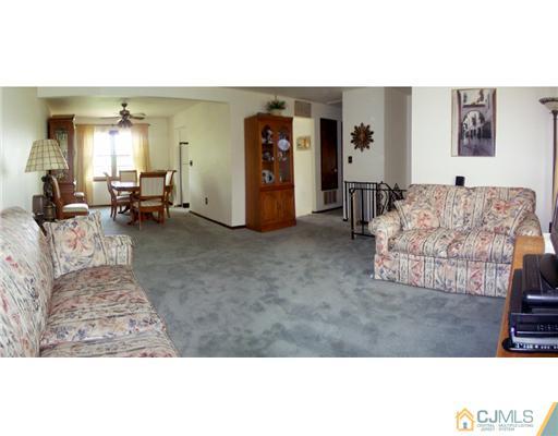 66 East Cliff Road Colonia, NJ 07067 - Photo 4 of 18 a living room with furniture and a dining table