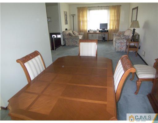 66 East Cliff Road Colonia, NJ 07067 - Photo 6 of 18 a living room with furniture and a large window