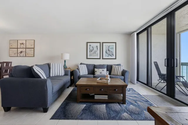 a living room with furniture and a rug