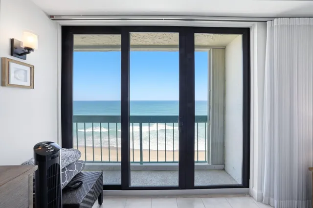 a view of a livingroom with furniture and windows