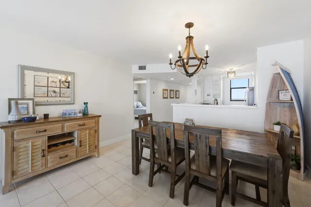 a view of a dining room with furniture and window