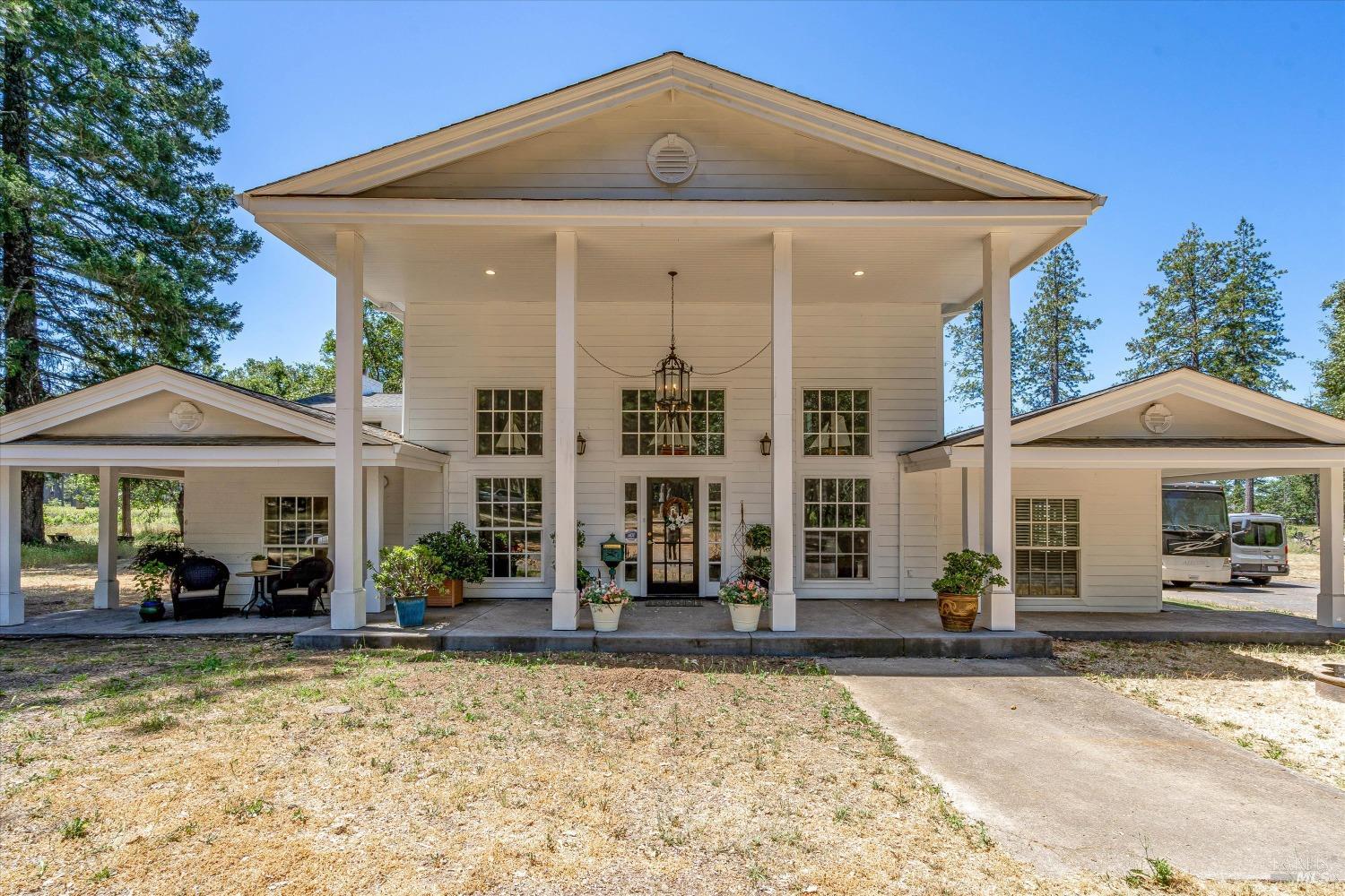 a front view of a house with garden