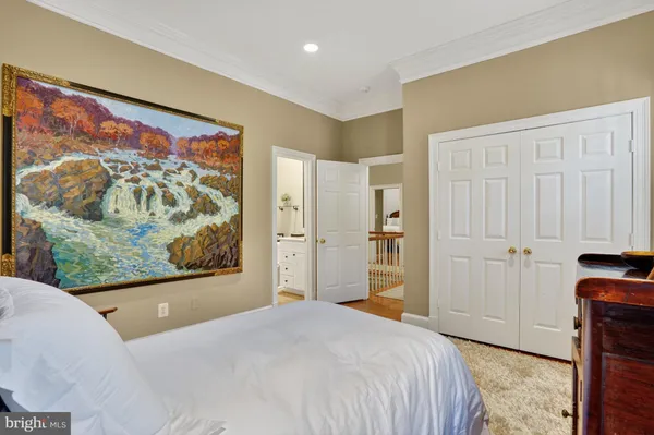 a bedroom with a bed and a view of bathroom