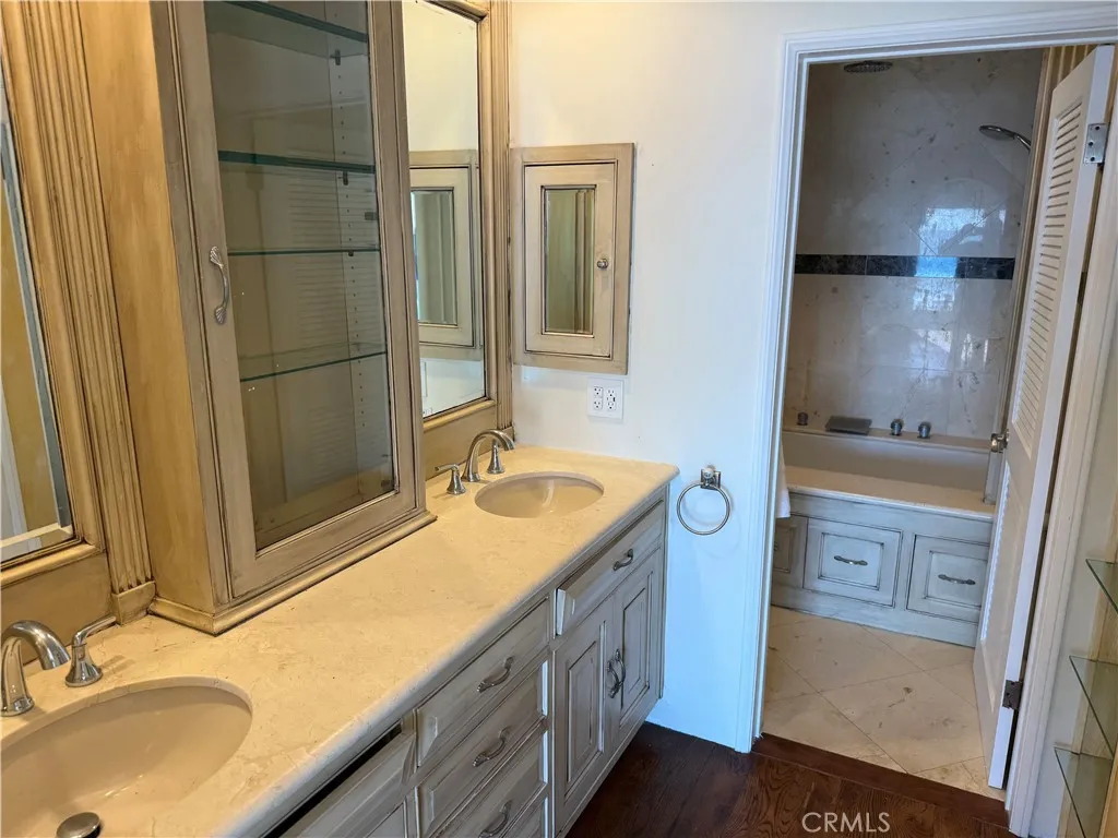 87 Surfside Avenue Surfside, CA 90743 - Photo 11 of 14 a bathroom with a sink and a mirror