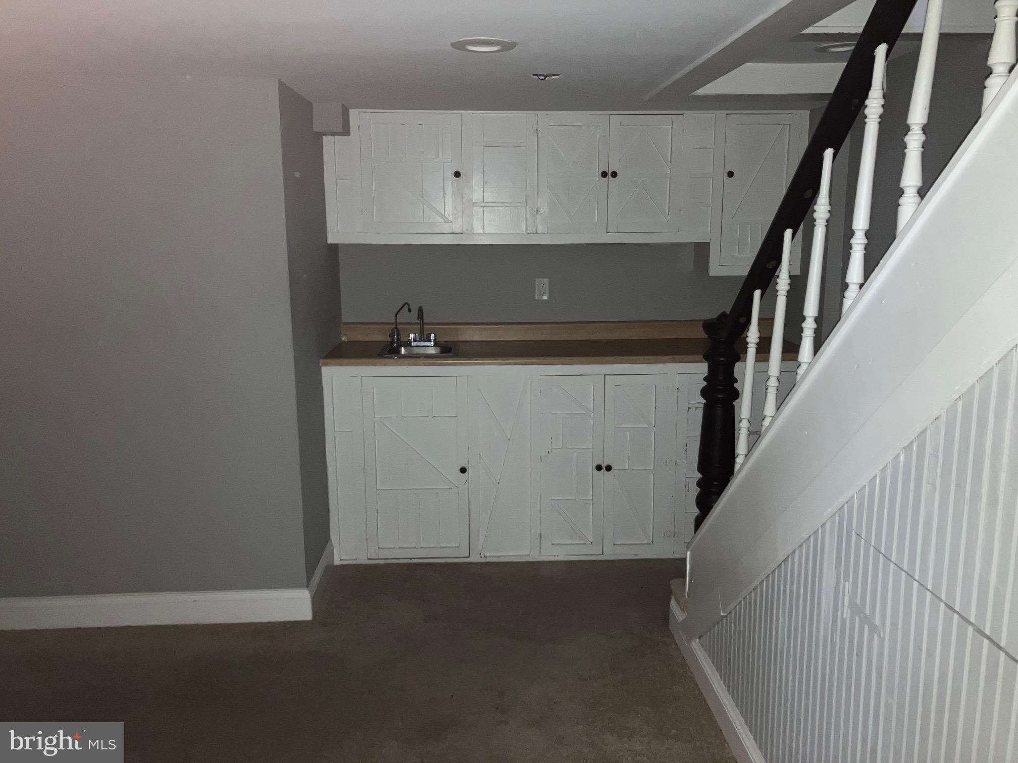 4008 Deepwood Road Baltimore, MD 21218 - Photo 15 of 18 a view of room with stairs and wooden floor