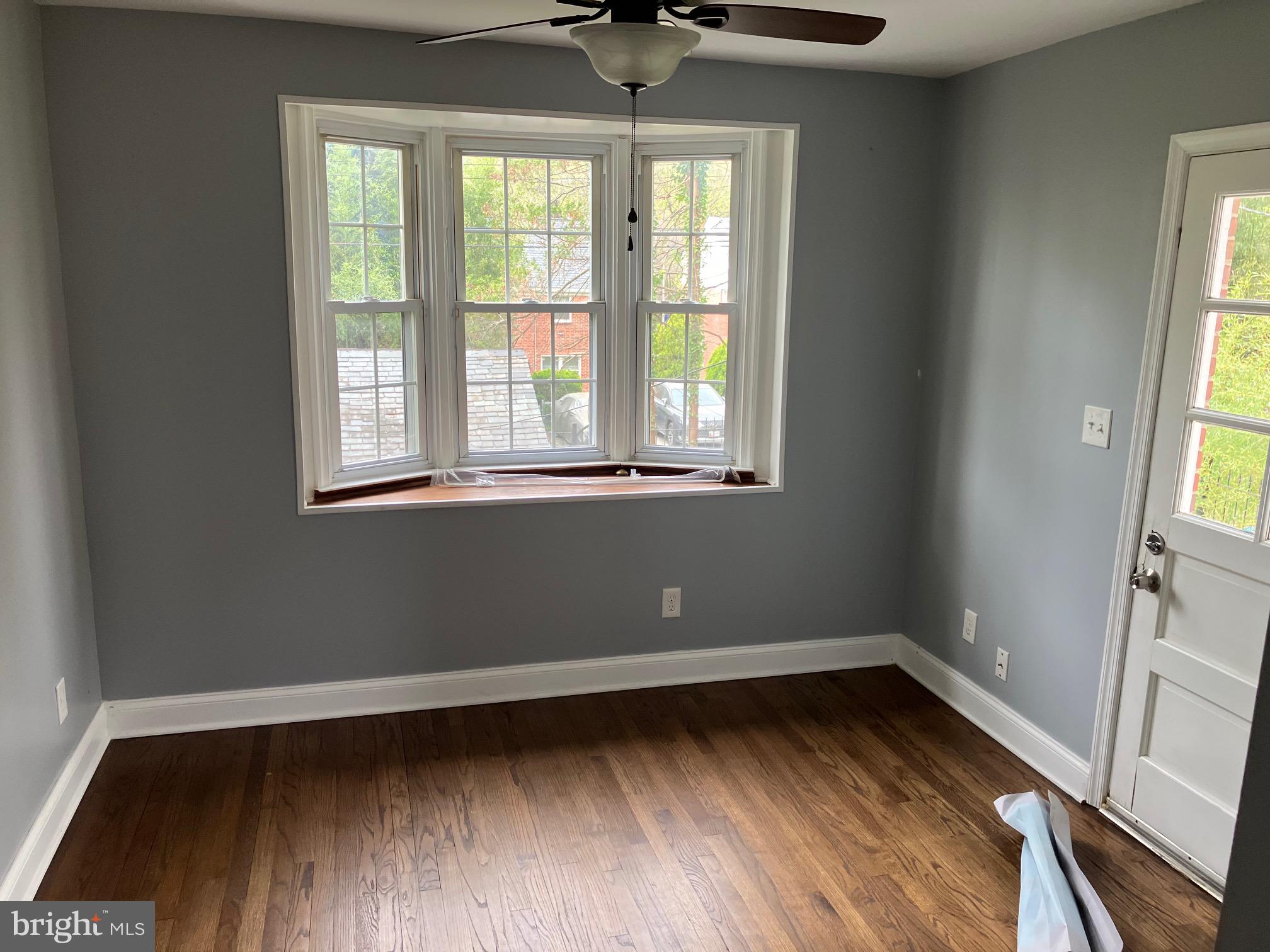 4008 Deepwood Road Baltimore, MD 21218 - Photo 4 of 18 a view of a room with wooden floor and a window