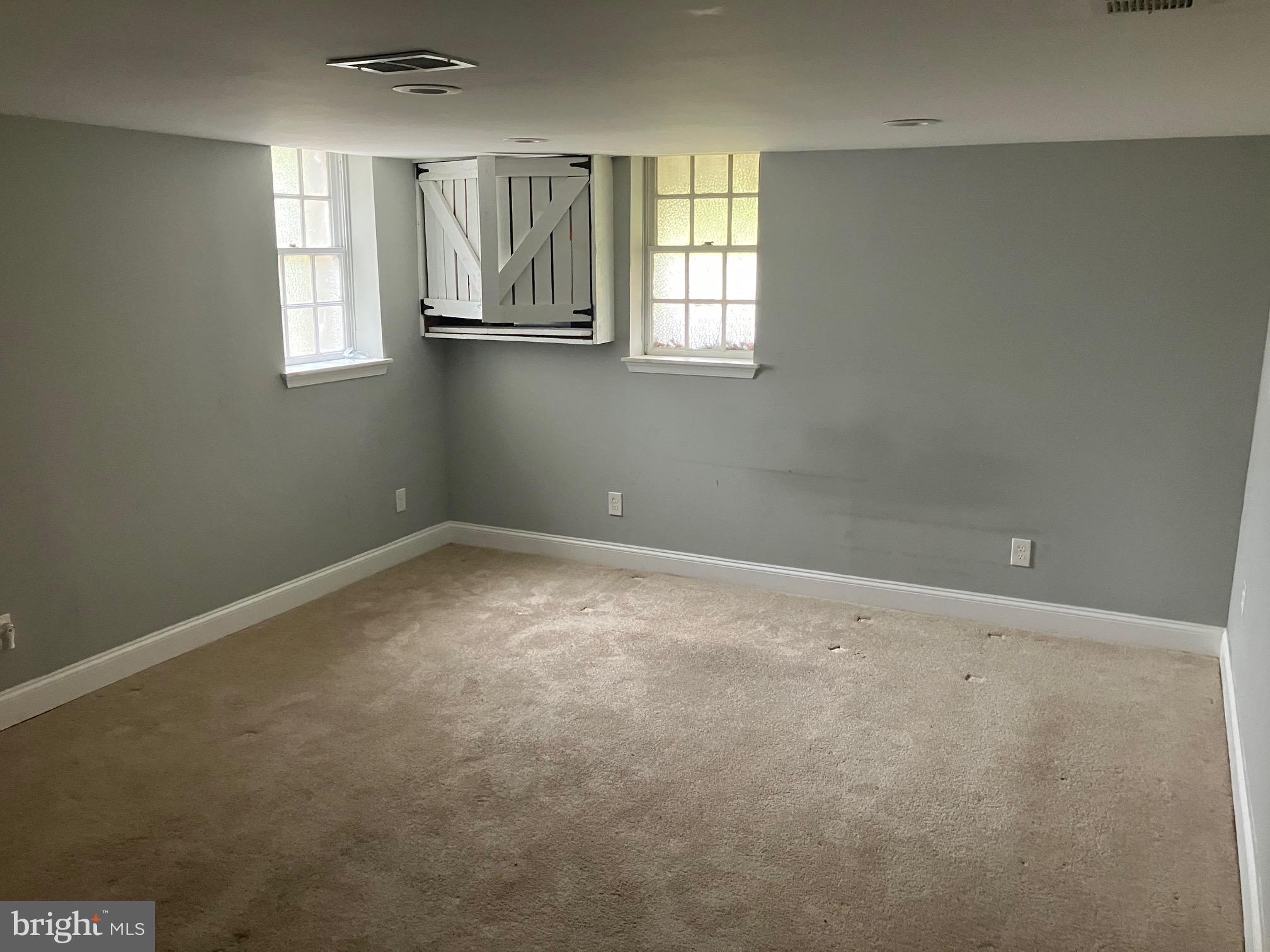 4008 Deepwood Road Baltimore, MD 21218 - Photo 6 of 18 an empty room with windows