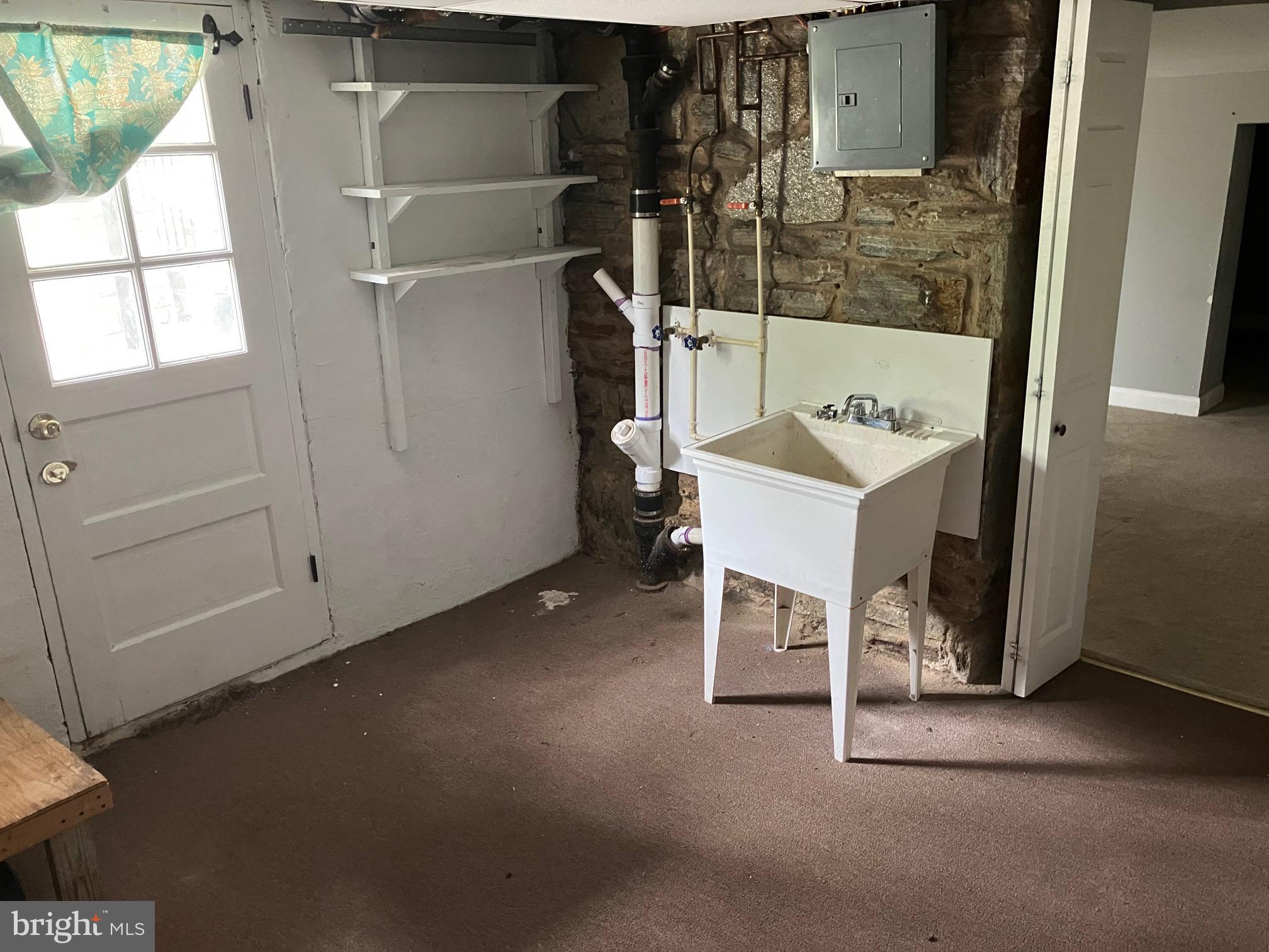 4008 Deepwood Road Baltimore, MD 21218 - Photo 7 of 18 a bathroom with a sink and a mirror