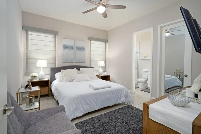 a bedroom with a bed and window