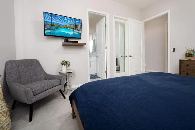 a bedroom with a bed and a couch