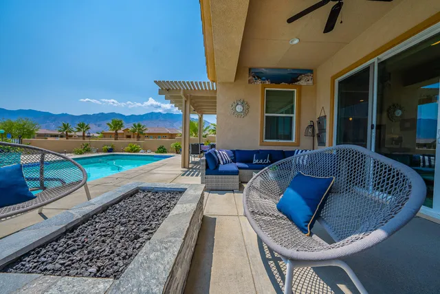a view of a patio with couches table and chairs