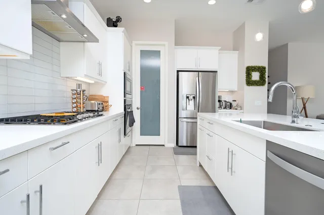 a large bathroom with a double vanity sink and mirror