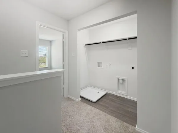 a view of a hallway with white walls