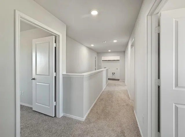 an empty room with a empty space and windows