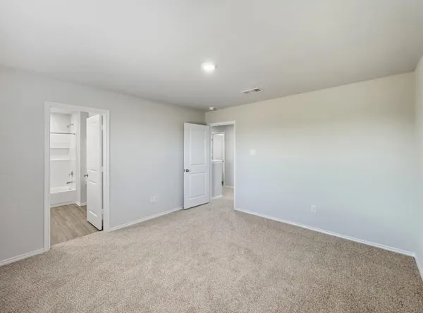 a bathroom with a sink a toilet a mirror and vanity