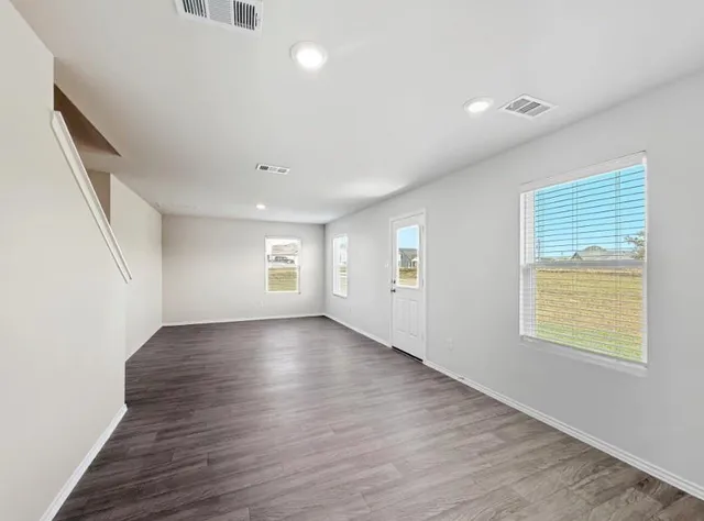 a kitchen with kitchen island a sink appliances and cabinets