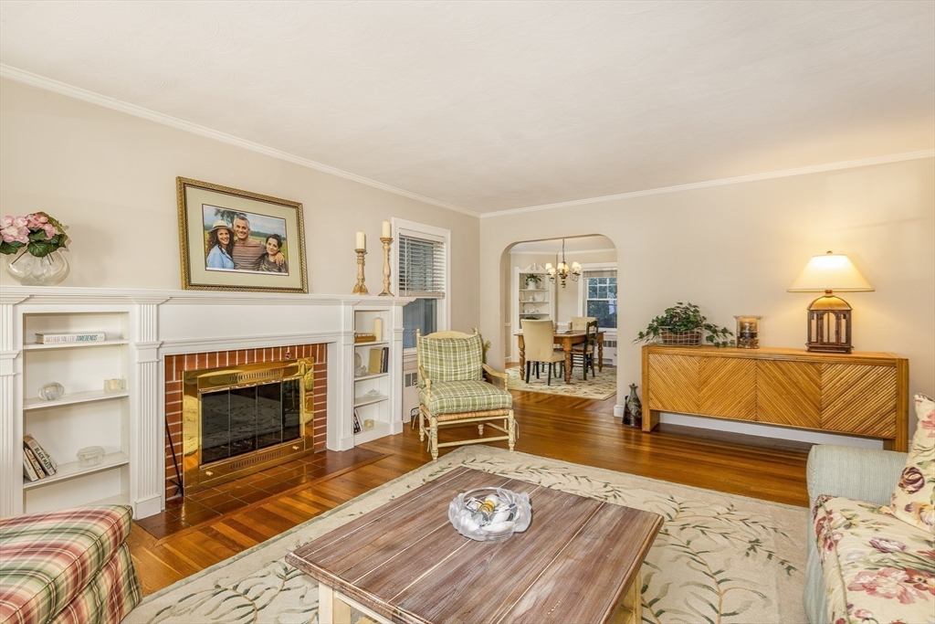 27 Preston Beach Road Marblehead, MA 01945 - Photo 6 of 32 a living room with furniture and a fireplace
