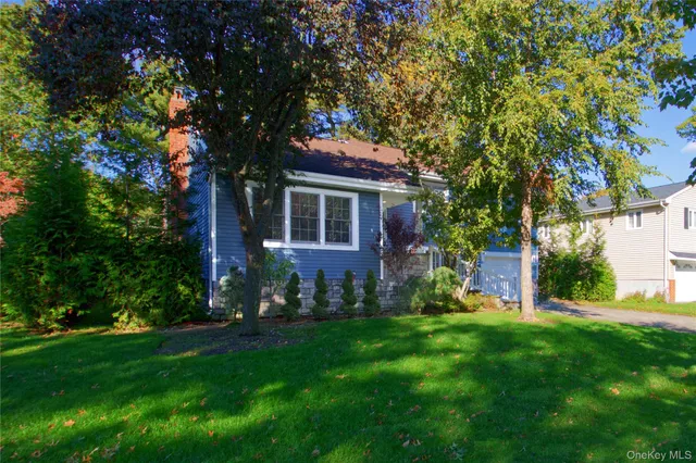 a view of house with backyard