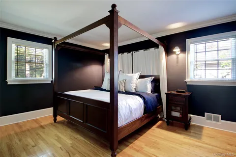 a bed room with a bed and a window